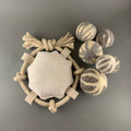 dog fetch toy with pile of wool balls