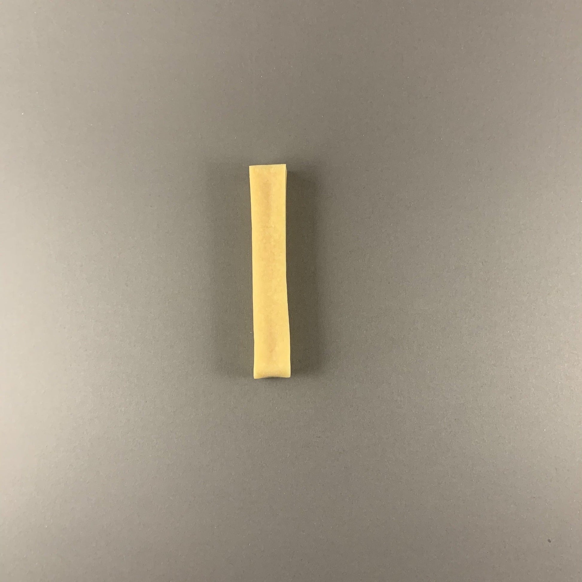 single piece of natural dog cheese
